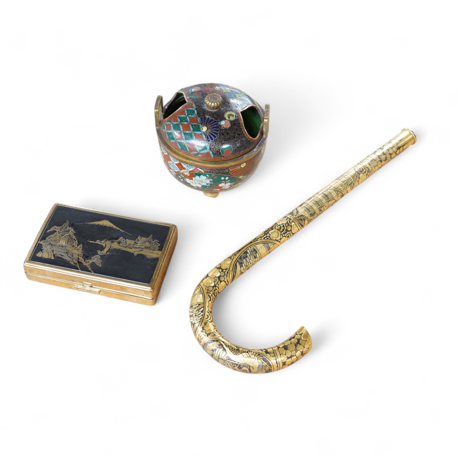 A Japanese damascened iron parasol handle, a cloisonné enamel koro and Komai style mirrored musical compact, largest 24cm in length